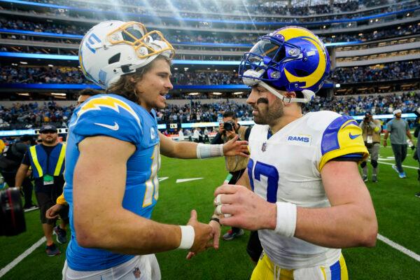 Los Angeles Chargers quarterback Justin Herbert (10) and Los Angeles Rams quarterback Baker Mayfield (17) shake hands after an NFL football game in Inglewood, Calif., on Jan. 1, 2023. (Marcio Jose Sanchez/AP Photo)