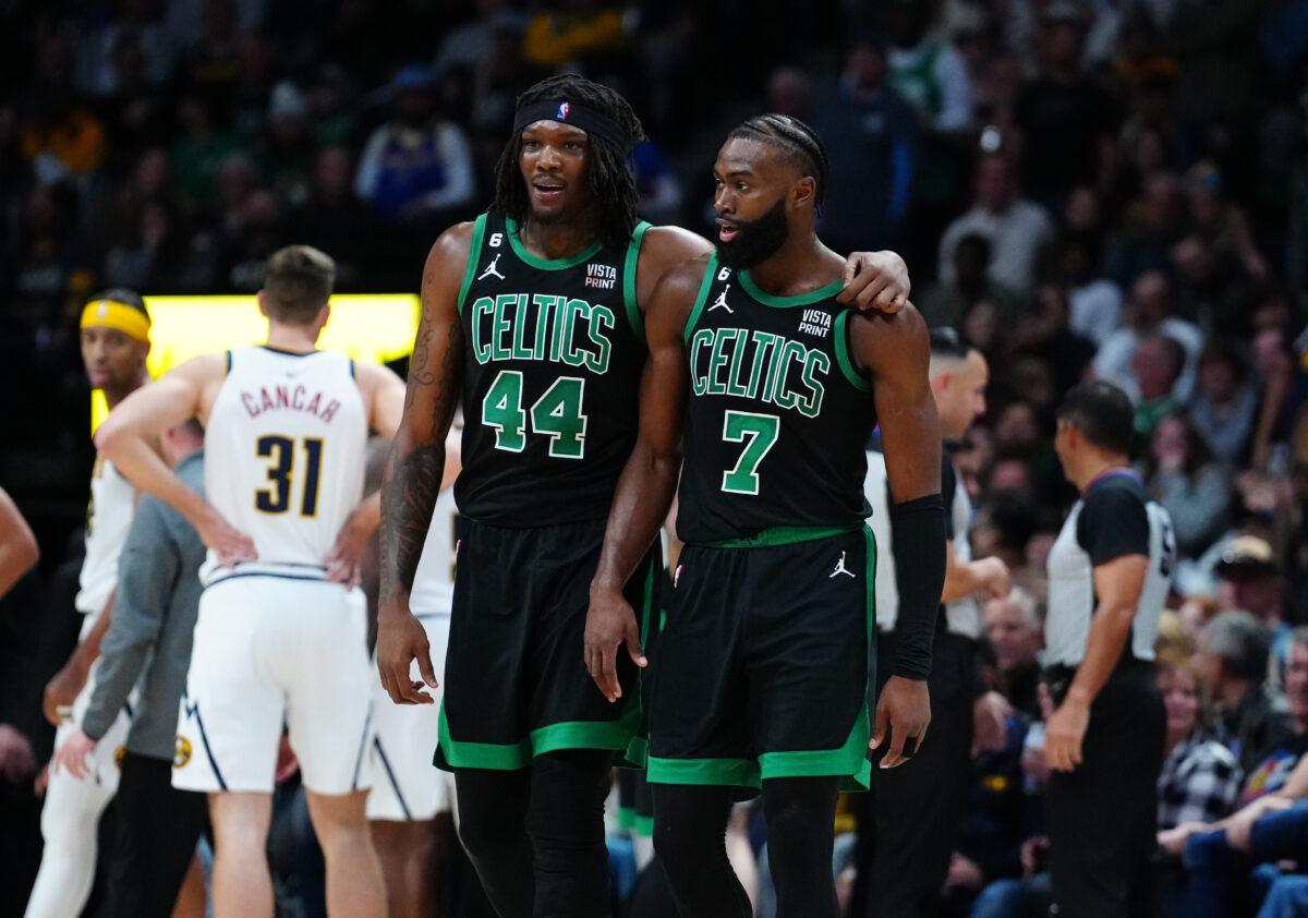 Boston Celtics center Robert Williams III (44) and guard Jaylen Brown (7) talk during the second half against the Denver Nuggets at Ball Arena in Denver on Jan. 1, 2023. (Ron Chenoy/USA TODAY Sports via Reuters)