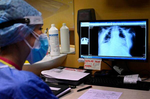 A nurse views the lung X-rays of a COVID-19 patient at the Casalpalocco hospital, south of Rome, on Oct. 13, 2021. (ALBERTO PIZZOLI/AFP via Getty Images)