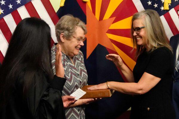 The new Arizona Democratic governor Katie Hobbs (R) pauses during taking the oath of office in a ceremony at the state Capitol in Phoenix, on Jan. 2, 2023. (Ross D. Franklin, Pool/AP Photo)