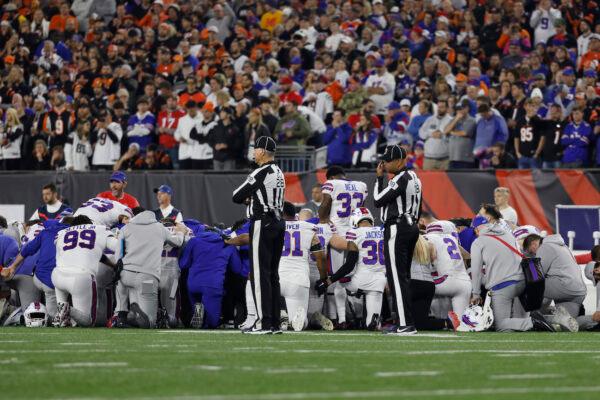 Buffalo Bills players huddle after teammate Damar Hamlin #3 collapsed following a tackle against the Cincinnati Bengals during the first quarter at Paycor Stadium in Cincinnati, Ohio, on Jan. 2, 2023. (Kirk Irwin/Getty Images)