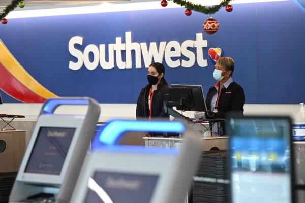 Southwest Airlines staff tend the counter in the check-in area, at Los Angeles International Airport on Dec. 28, 2022. (Robyn Beck/AFP via Getty Images)