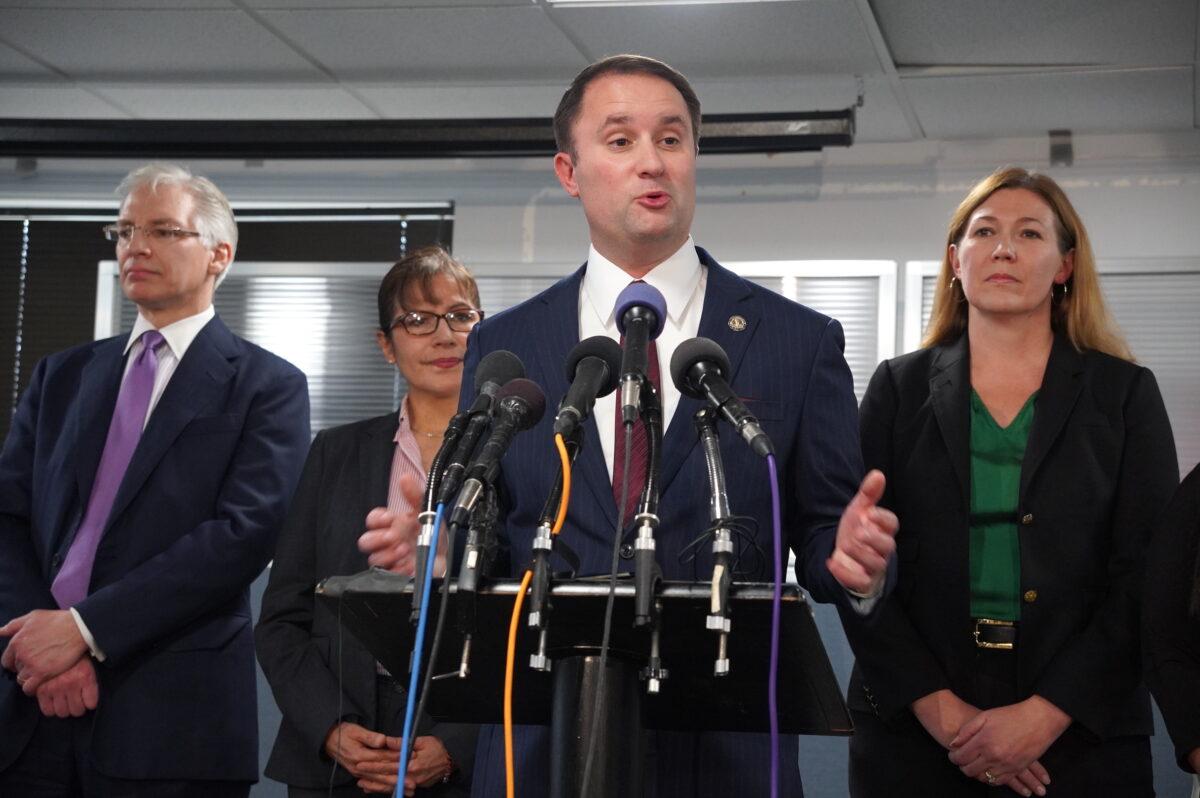 Virginia Attorney General Jason Miyares (C) announces investigations on Thomas Jefferson High School's delay in informing students of national recognitions and the school's admission policies in Alexandria, Va., on Jan. 4, 2023. (Terri Wu/The Epoch Times)
