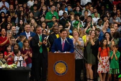 Arizona Gov. Doug Ducey attends a celebration of the signing of a universal Empowerment Scholarship law that allows all students to use an ESA account to attend the school of their choice. (Courtesy of Gov. Doug Ducey's office)