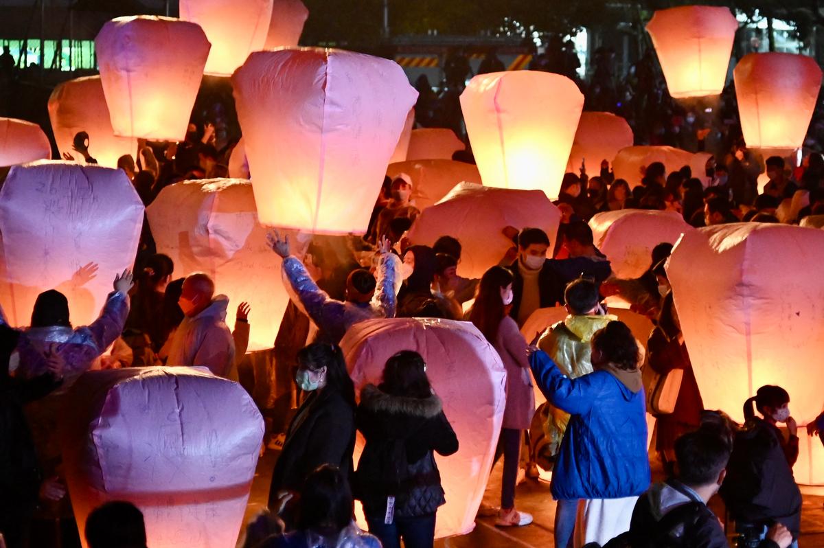 Local residents release sky lanterns to mark the Lunar Lantern Festival in Pingxi district, New Taipei City, on Feb. 12, 2022. (Sam Yeh/AFP via Getty Images)