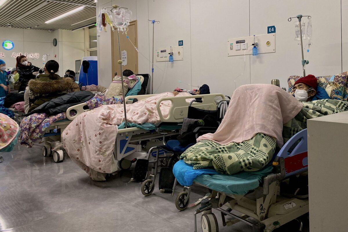 This picture shows Covid-19 patients on beds at Tianjin Nankai Hospital in Tianjin on Dec. 28, 2022.(Noel Celis/AFP via Getty Images)
