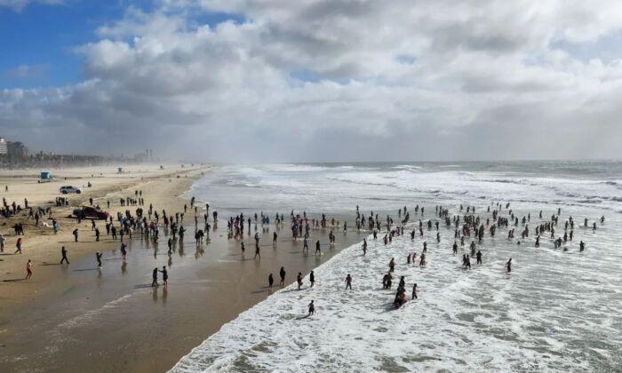 Hundreds Soak in the New Year at the Annual Surf City Splash