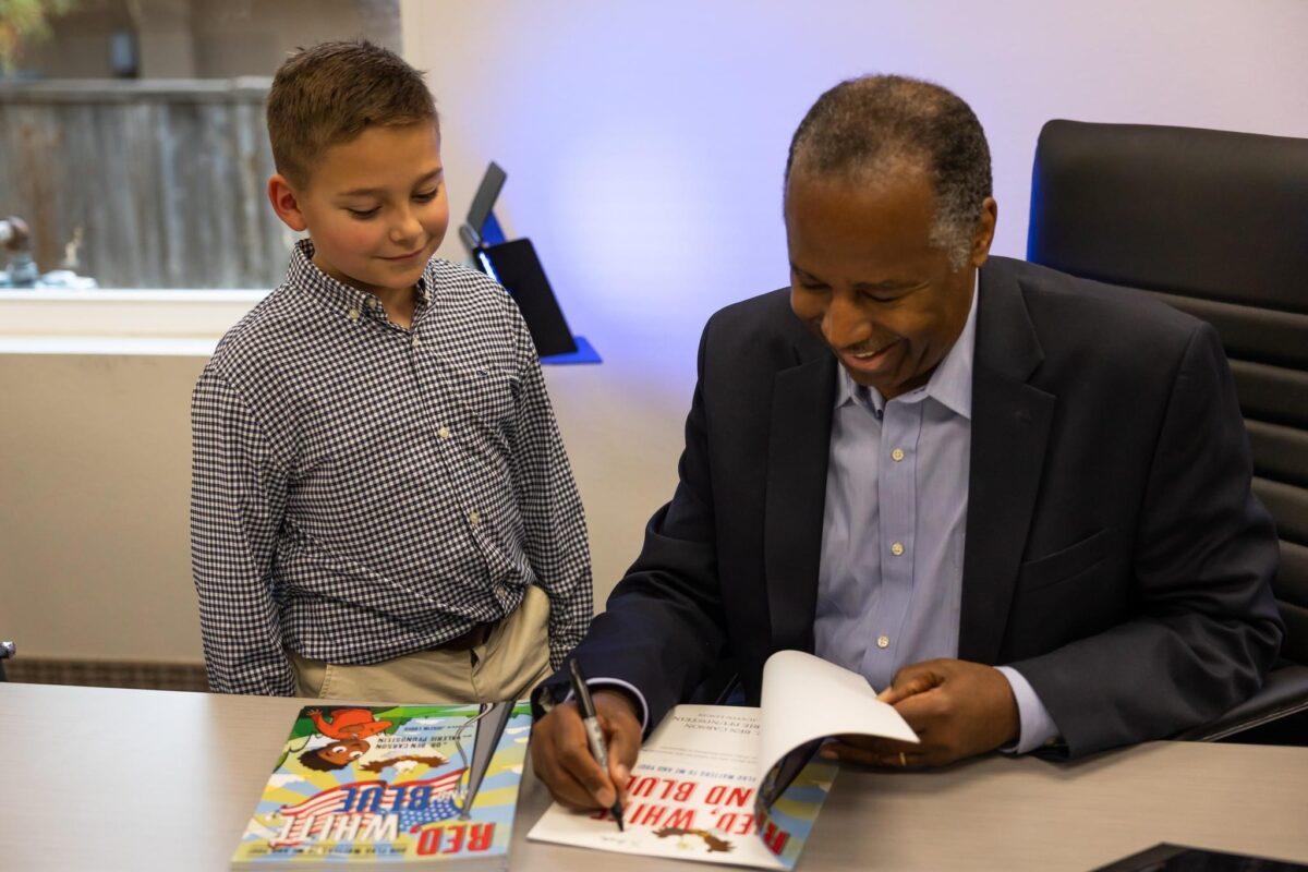 Dr. Ben Carson has published two children’s books so far as supplements to the educational curriculum offered at American Cornerstone Institute. He is pictured here at the Patriot Mobile headquarters in November 2022 at a book signing for "Red, White and Blue Our Flag Matters to Me and You." (Courtesy of the American Cornerstone Institute)