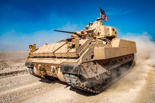 A U.S. Bradley Fighting Vehicle (BFV) patrols in the Suwaydiyah oil fields in Syria's northeastern Hasakah province on Feb. 13, 2021. (Delil Souleiman/AFP via Getty Images)