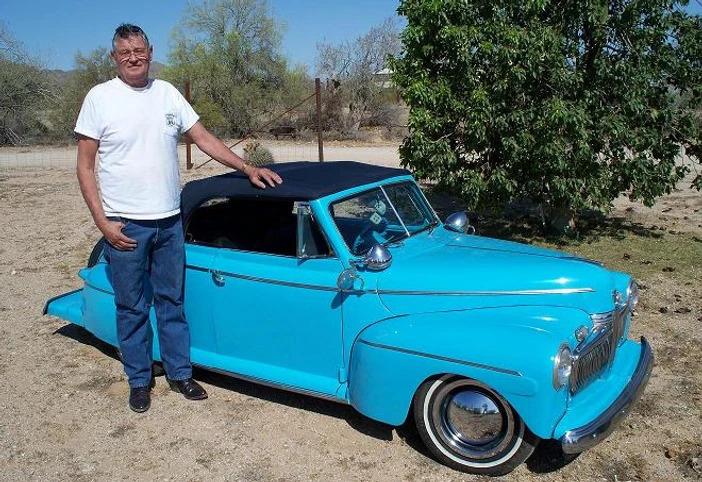 Adams next to his dwarf ’42 Ford Deluxe Convertible, made in 1999. (Courtesy of <a href="https://www.dwarfcarpromotions.com/">Ernie Adams</a>)