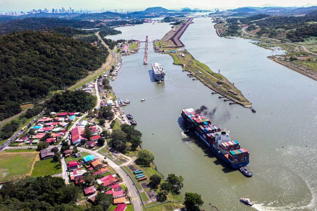 Aerial view of Panama Canal in the area of Pedro Miguel locks, in Panama City on Dec. 13, 2022. Every time a ship crosses the Miraflores Lock, the Panama Canal's most famous gate, 200 million liters of fresh water are discharged into the sea. This operation was repeated more than 14,000 times during 2022 in this strategic passageway linking the world's two largest oceans, whose main source of energy to move ships is rainwater. (Courtesy of Luis Acosta/AFP via Getty Images)