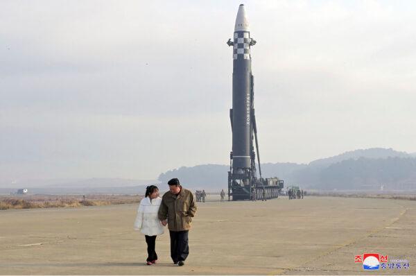 North Korean leader Kim Jong Un (R) and his daughter at the site of a missile launch at Pyongyang International Airport in Pyongyang, North Korea, on Nov. 18, 2022. (Korean Central News Agency/Korea News Service via AP)