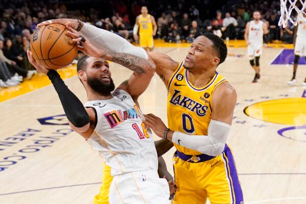 Los Angeles Lakers guard Russell Westbrook, right, blocks the shot of Miami Heat forward Caleb Martin during the first half of an NBA basketball game in Los Angeles on Jan. 4, 2023. (Mark J. Terrill/AP Photo)