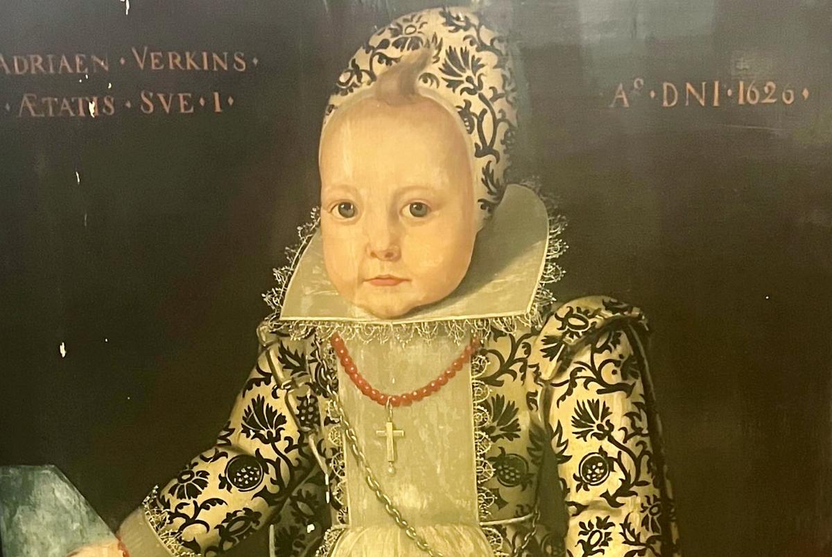 A forgotten 400-year-old portrait of a "miniature adult" in an elaborate full-length gown. (SWNS)