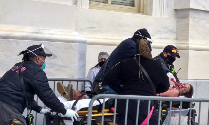 Paramedics from the D.C. Fire and EMS Department perform CPR on protester Ashli Babbitt, who was shot by police near the Speaker's Lobby on Jan. 6, 2021. (Courtesy of Steve Baker)