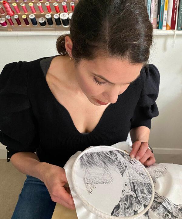 Mixed media artist Susannah Weiland hand embroiders one of her pencil drawings. Weiland often photographs her work at the start and end of each day to see her progress. (Courtesy of Susannah Weiland)