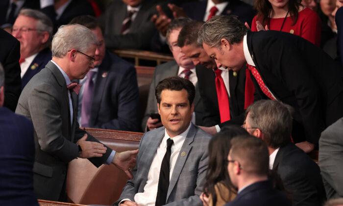 U.S. Rep.-elect Patrick McHenry (R-N.C.) (L) and Rep.-elect Andy Ogles (R-Tenn.) (R) speak with Rep.-elect Matt Gaetz (R-Fla.) in the House Chamber on Jan. 6, 2023. (Win McNamee/Getty Images)