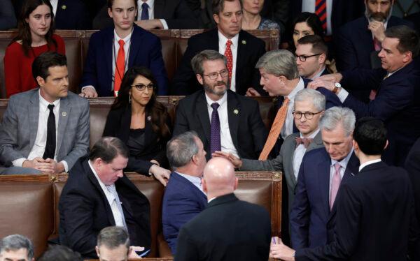 U.S. Rep.-elect Mike Rogers (R-Ala.) is restrained by Rep.-elect Richard Hudson (R-N.C.) after getting into an argument with Rep.-elect Matt Gaetz (R-Fla.) as House Republican Leader Kevin McCarthy (R-Calif.) walks away, in the House Chamber during the fourth day of elections for speaker of the House at the U.S. Capitol Building on Jan. 6, 2023. (Anna Moneymaker/Getty Images)
