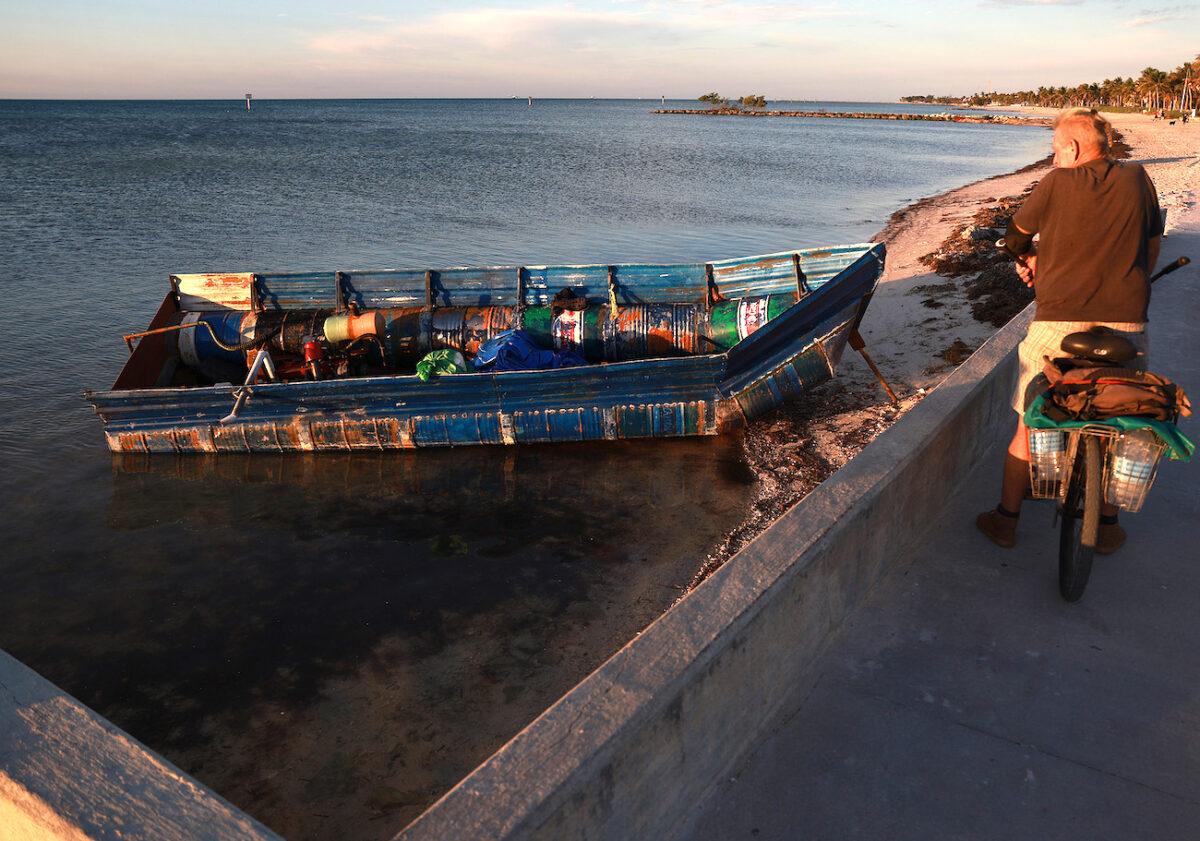A boat that was left along the shoreline after it was used recently to transport Cuban illegal aliens from the island nation to America in Key West, Florida, on Jan. 6, 2023. (Joe Raedle/Getty Images)