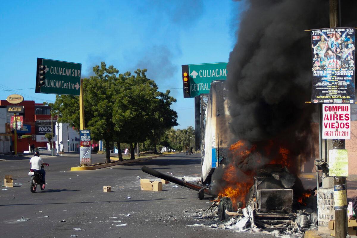 A truck burns after being set on fire on a street in Culiacan, Sinaloa state, on Jan. 5, 2023. (Martin Urista/AP Photo)