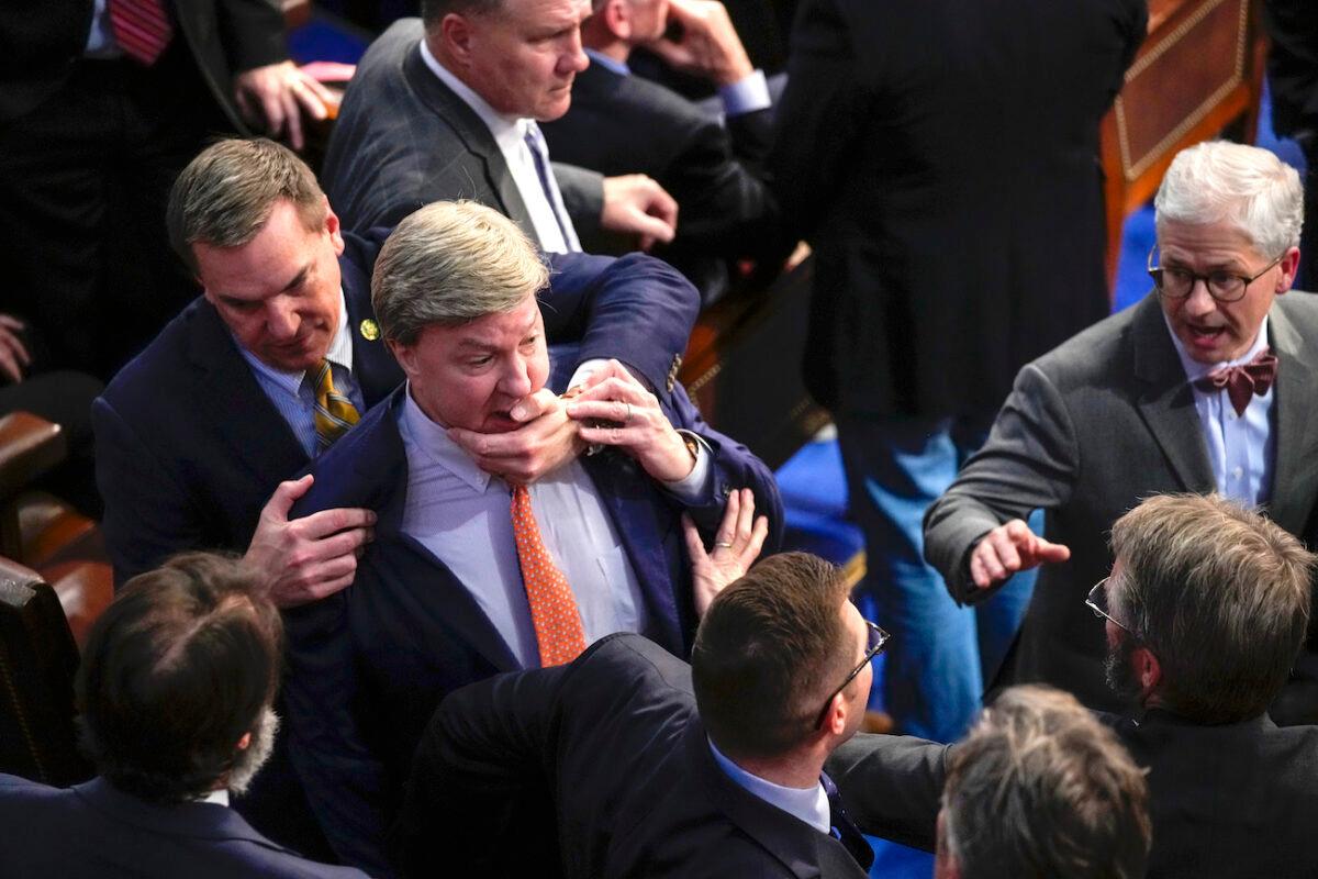 Rep. Richard Hudson (R-N.C.) (L) pulls Rep. Mike Rogers (R-Ala.) back as they talk with Rep. Matt Gaetz (R-Fla.) and others during the 14th round of voting for Speaker on Jan. 6, 2023. (Andrew Harnik/AP Photo)