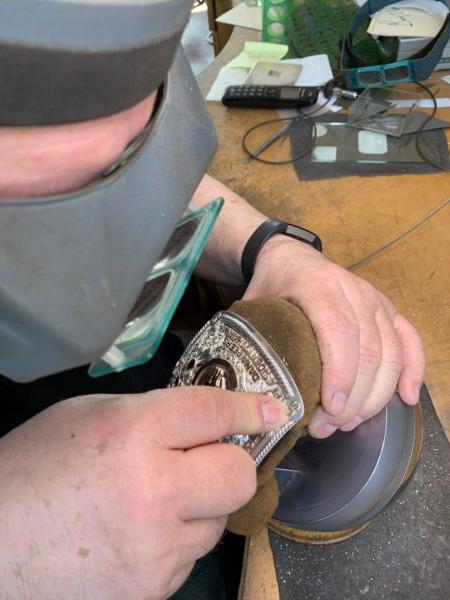 Silversmith Scott Hardy works on a silver belt buckle. (Leslie Hardy)