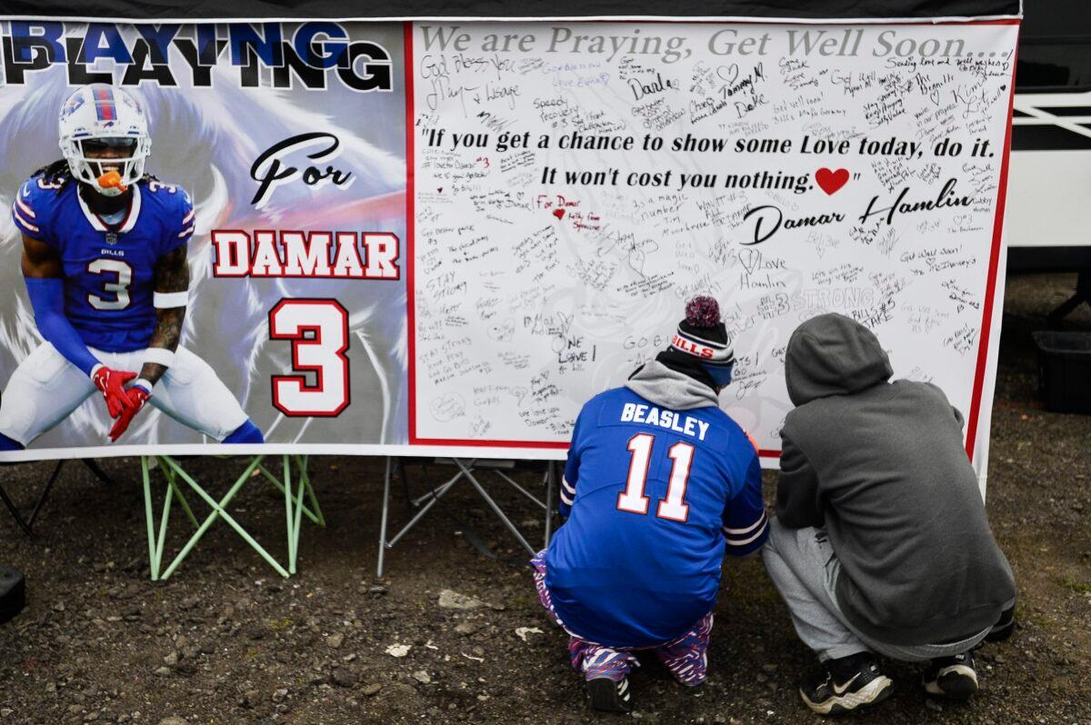 Fans leave messages of support for Buffalo Bills safety Damar Hamlin (3) on a poster outside Highmark Stadium before an NFL football game against the New England Patriots in Orchard Park, N.Y., on Jan. 8, 2023. (Adrian Kraus/AP Photo)