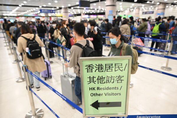 People line up at the Lok Ma Chau Control Point at the Shenzhen border crossing with mainland China in Hong Kong on Jan. 8, 2023. (Peter Parks /AFP via Getty Images)
