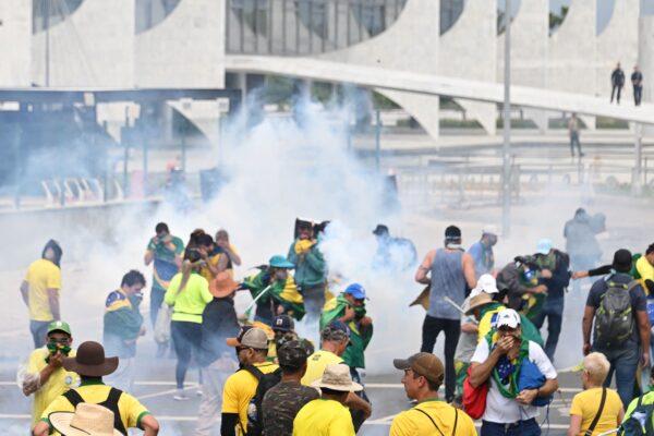 Supporters of Brazilian former President Jair Bolsonaro clash with the police during a demonstration outside the Planalto Palace in Brasilia on Jan. 8, 2023. (Evaristo Sa/AFP via Getty Images)
