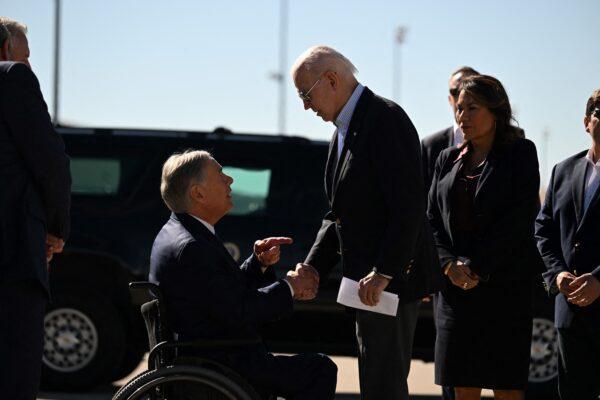President Joe Biden shakes hands with Texas Gov. Greg Abbott upon arrival at El Paso International Airport in El Paso, Texas, on Jan. 8, 2023. (Jim Watson/AFP via Getty Images)