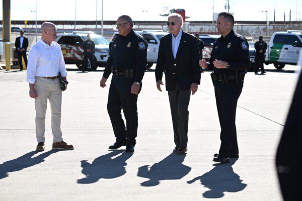 President Joe Biden and Secretary of Homeland Security Alejandro Mayorkas (L) speak with U.S. Customs and Border Protection police on the Bridge of the Americas border crossing in El Paso, Texas, on Jan. 8, 2023. (Jim Watson/AFP via Getty Images)