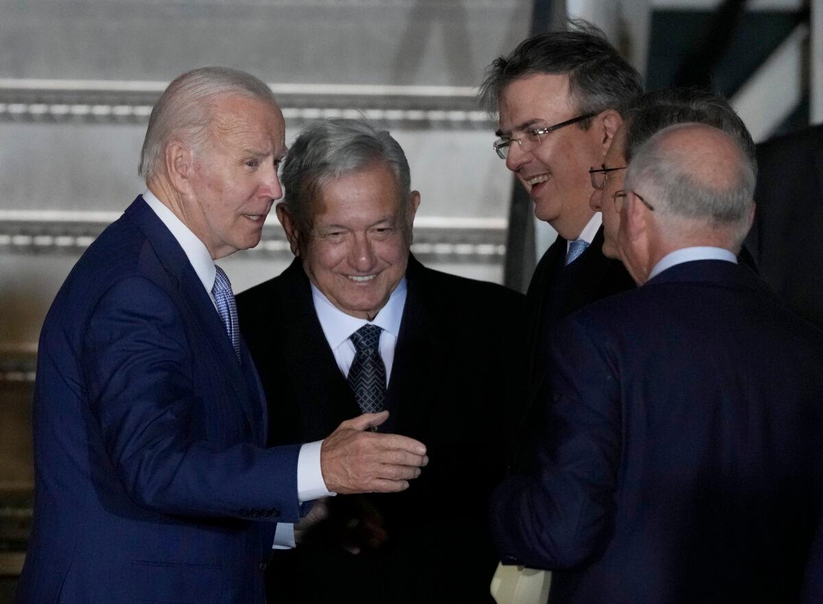 U.S. President Joe Biden (L) is greeted at his arrival by Mexican President Andres Manuel Lopez Obrador (2L) at Biden's arrival to the Felipe Angeles international airport in Zumpango, Mexico, on Jan. 8, 2023. (Fernando Llano/AP Photo)