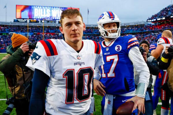 New England Patriots quarterback Mac Jones (10) and Buffalo Bills quarterback Josh Allen (17) meet on the field after an NFL football game in Orchard Park, N.Y., on Jan. 8, 2023. (Jeffrey T. Barnes/AP Photo)