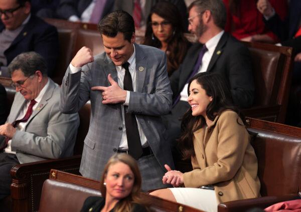 U.S. Rep.-elect Matt Gaetz (R-Fla.) flexes his arm alongside Rep.-elect Anna Paulina Luna (R-Fla.) after getting into an argument with Rep.-elect Mike Rogers (R-Ala.) in the House Chamber during the fourth day of elections for House Speaker at the U.S. Capitol Building in Washington on Jan. 6, 2023. (Win McNamee/Getty Images)