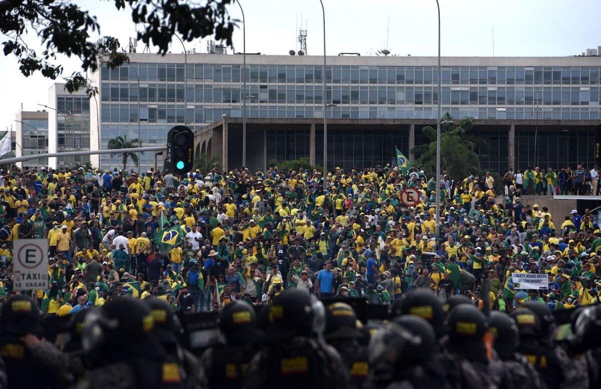 Protesters, many of whom support Brazilian former President Jair Bolsonaro, surround several governmental buildings as they are confronted by security forces in Brasilia on Jan. 8, 2023. (Ton Molina/AFP via Getty Images)