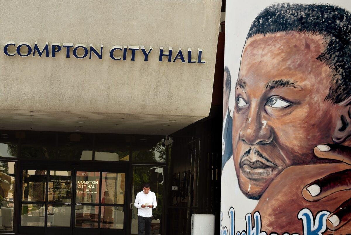 A man walk past a mural of Martin Luther King, Jr. outside City Hall in Compton, Calif., on Aug. 21, 2015. (Mark Ralston/AFP via Getty Images)
