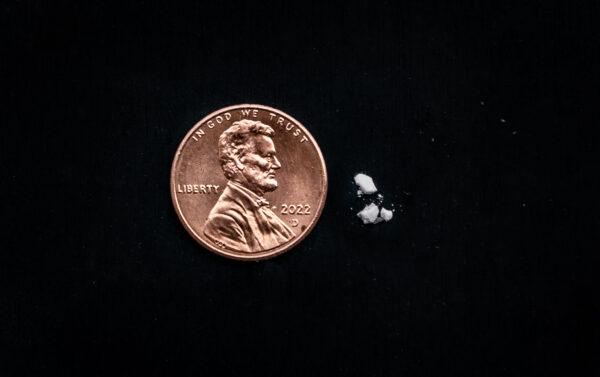 Mock sizing of a potentially lethal dose of fentanyl is shown in this illustration on April 1, 2022. (John Fredricks/The Epoch Times)