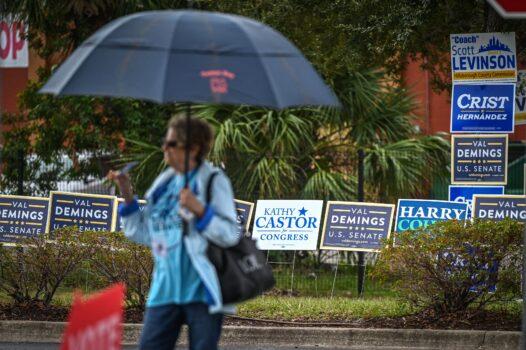 A person stands outside a polling site during the U.S. midterm election in St. Petersburg, Fla., on Nov. 8, 2022. (Giorgio Viera/AFP via Getty Images)