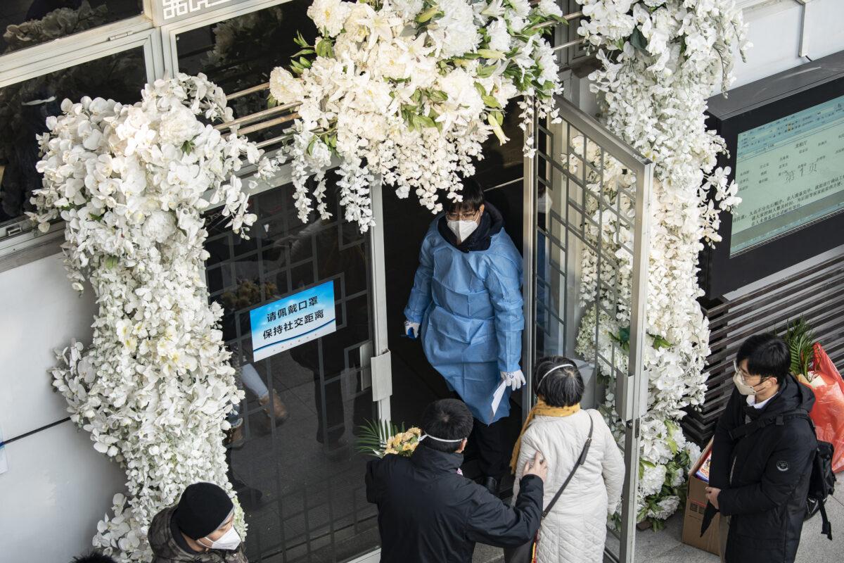Mourners gather outside the memorial halls for the deceased at a funeral home in Shanghai, China, on Dec. 31, 2022. (Qilai Shen/Bloomberg via Getty Images)