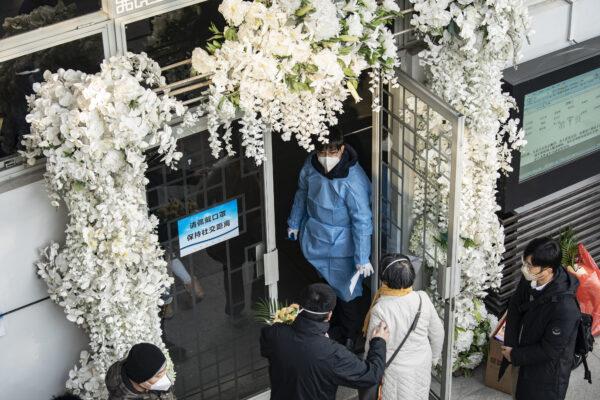 Mourners gather outside memorial halls for the deceased at a funeral home in Shanghai, China, on Dec. 31, 2022. (Qilai Shen/Bloomberg via Getty Images)