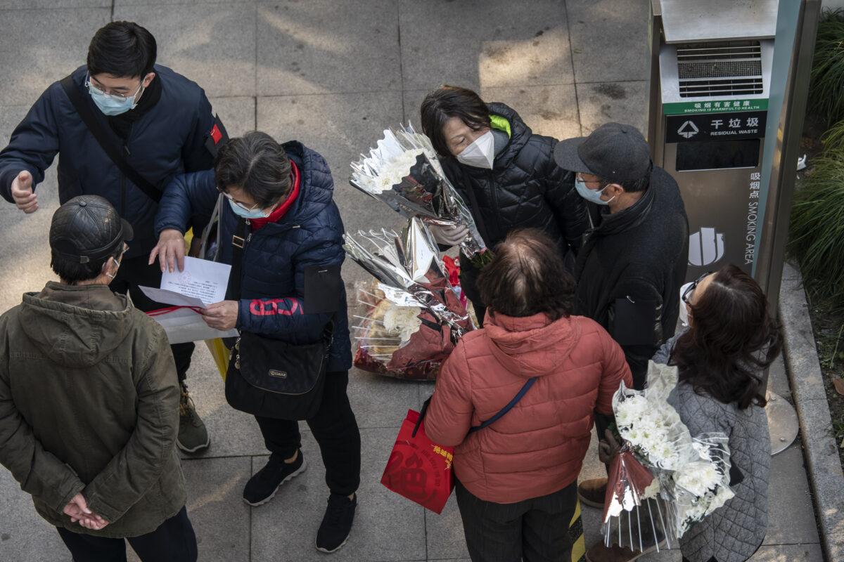 Mourners gather outside the memorial halls for the deceased at a funeral home in Shanghai on Dec. 31, 2022. (Qilai Shen/Bloomberg via Getty Images)