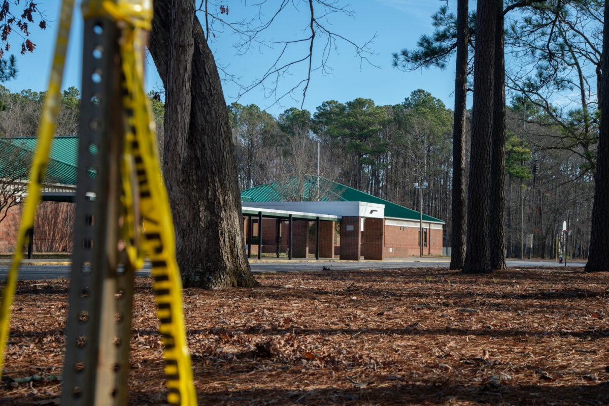 Police tape hangs from a sign post outside Richneck Elementary School following a shooting in Newport News, Virginia, on Jan. 7, 2023. (Jay Paul/Getty Images)