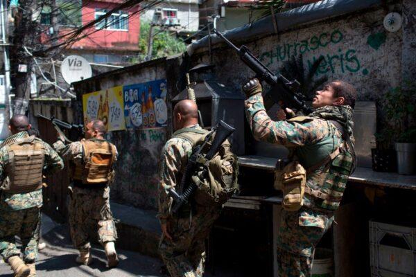 Members of the Special Police Unit (BOPE) patrol during an operation in the Rocinha favela in Rio de Janeiro, Brazil, on Jan. 25, 2018. (Mauro Pimentel/AFP via Getty Images)
