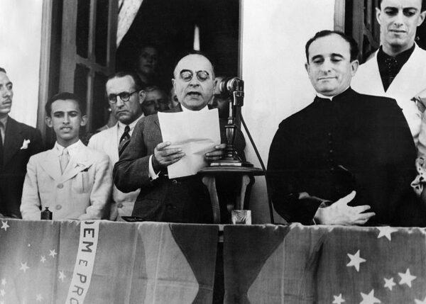 Getulio Vargas (1883-1954), President of Brazil, delivers a broadcast speech to announce the dissolution of congress and to proclaim the fascist "Estado Novo" ("New State") dictatorship in Rio de Janeiro, Brazil, on Nov. 10, 1937. (OFF/AFP via Getty Images)