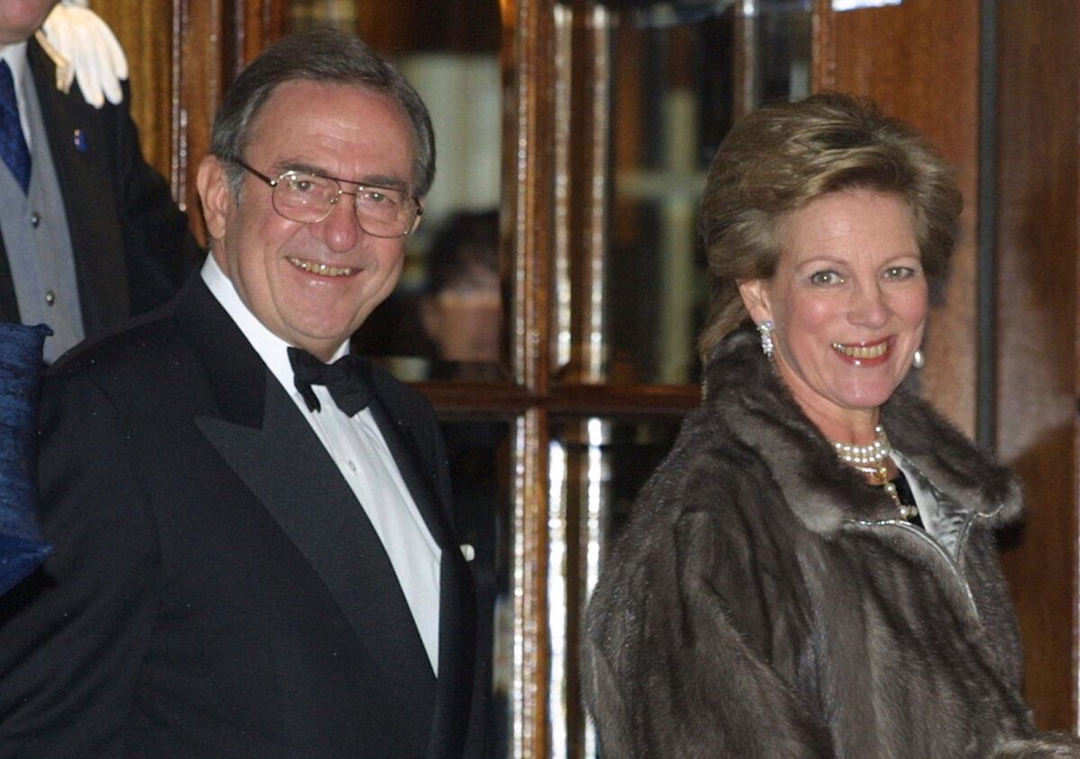 The former King of Greece Constantine and wife Anne-Marie arrive at the Ritz hotel in London on Nov. 14, 2002. (Alastair Grant/AP Photo)