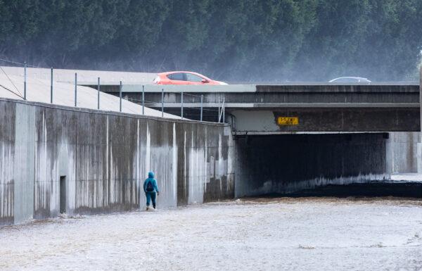 A bike path fills with water during a storm in Irvine, Calif., on Jan. 5, 2023. (John Fredricks/The Epoch Times)