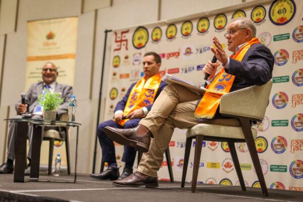 The Morrison government's decision to reduce the immigration quota from 190,000 to 160,000 has been criticised. Australian Prime Minister Scott Morrison (R) addresses the crowd during a Q&A alongside Australian Minister for Immigration Alex Hawke (Centre) at a Hindu Council of Australia Multicultural Event in the electorate of Parramatta on May 14, 2022 in Sydney, Australia. (Asanka Ratnayake/Getty Images)
