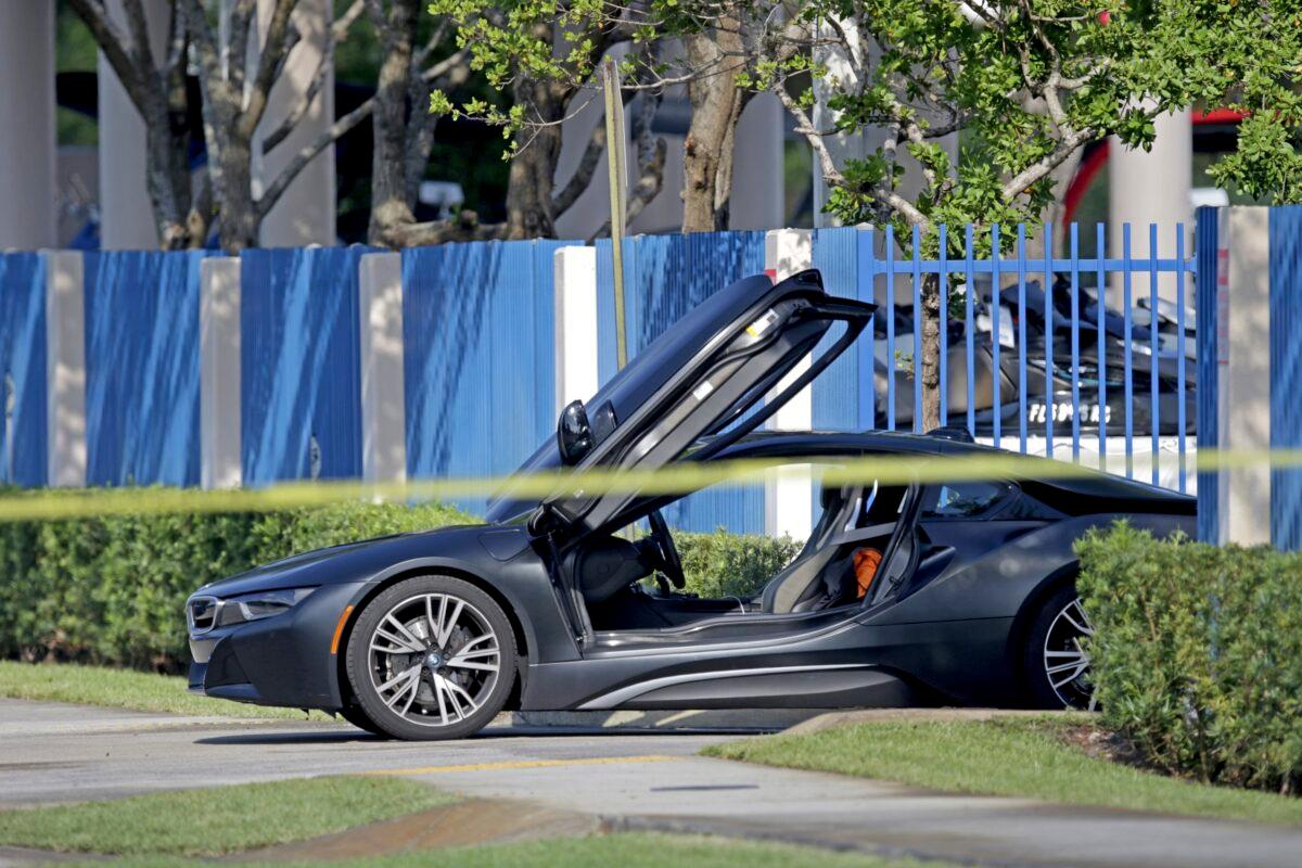An empty vehicle appears on a street where rapper XXXTentacion was shot in Deerfield Beach, Fla., on June 18, 2018. (John McCall/South Florida Sun-Sentinel via AP)