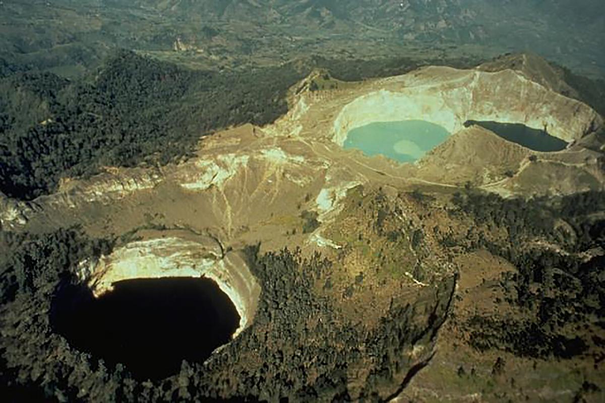 Three crater lakes can be seen from above at Mount Kelimutu in Flores, Indonesia. (<a href="https://commons.wikimedia.org/wiki/File:Kelimutu_crater_lakes.jpg">Public Domain</a>)