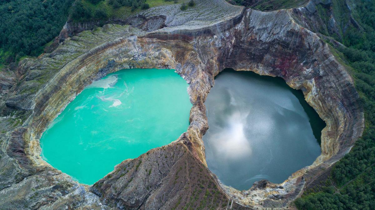 The crater lakes of Mount Kelimutu exhibit various colors. (Muhammad Nurudin/Shutterstock)